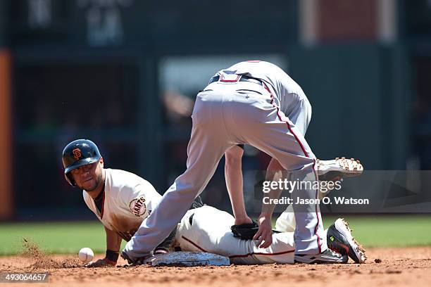 Gregor Blanco of the San Francisco Giants steals second base as Tyler Pastornicky of the Atlanta Braves is unable to catch the ball for a tag during...