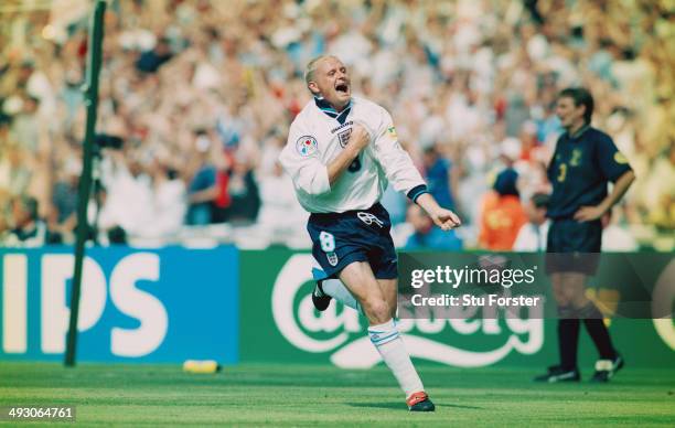 England player Paul Gascoigne celebrates after scoring the second goal during the European Championship Finals group match between England and...