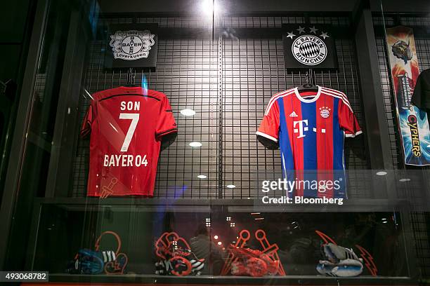 Bayer 04 Leverkusen and FC Bayern Munich soccer jerseys hang on display at the reception area of Nexon Co. E-Sports Stadium prior to the final round...