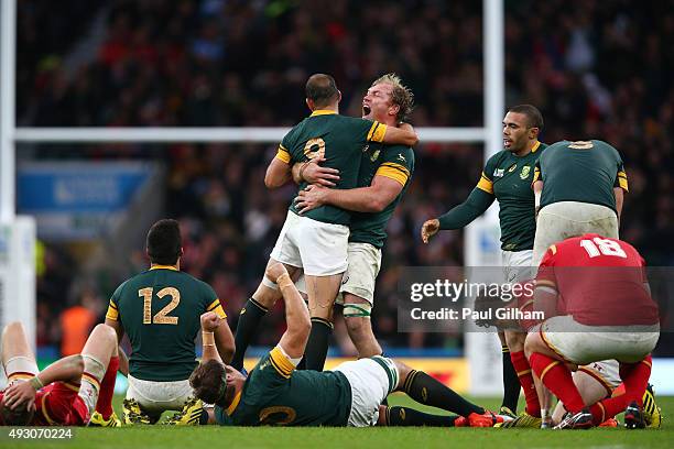 Schalk Burger of South Africa hugs Fourie Du Preez of South Africa as the match ends and SDouth Africa win during the 2015 Rugby World Cup Quarter...