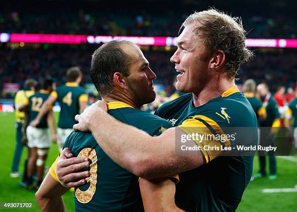 A jubilant Schalk Burger of South Africa and Fourie Du Preez of South Africa enbrace following victory in the 2015 Rugby World Cup Quarter Final...