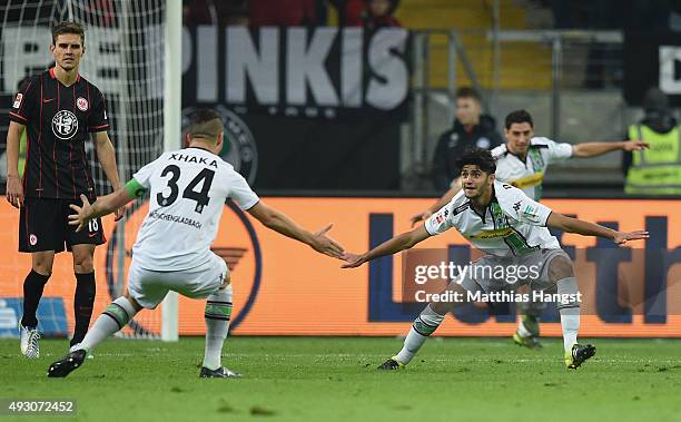 Mahmoud Dahoud of Gladbach celebrates with his team-mates after scoring his team's second goal during the Bundesliga match between Eintracht...