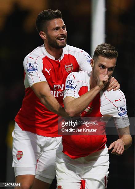 Aaron Ramsey of Arsenal celebrates with Olivier Giroud as he scores their third goal during the Barclays Premier League match between Watford and...