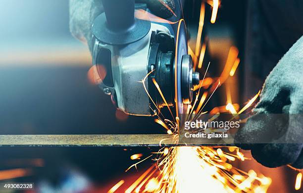grinding steel tube. - doorknippen stockfoto's en -beelden
