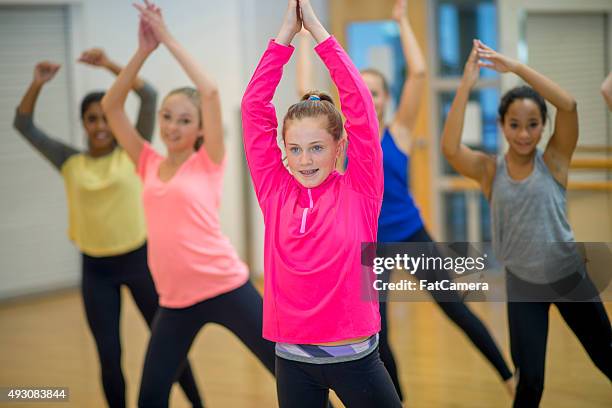 taking a zumba dance class together - indian dance kids stock pictures, royalty-free photos & images