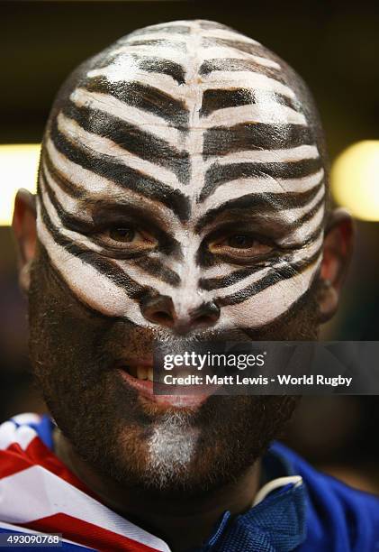 New Zealand fan, with silver fern face paint, looks forward to the action before the 2015 Rugby World Cup Quarter Final match between New Zealand and...