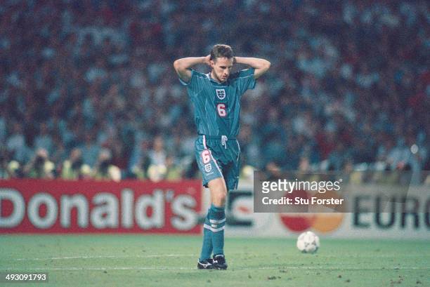 England player Gareth Southgate reacts after missing his penalty during the penalty shoot out, during the European Championship Finals semi final...