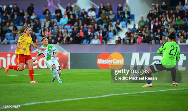 Martina Mueller of VfL Wolfsburg shoots past goalkeeper Carola Soberg of Tyreso FF celebrates to score their second goal during the UEFA Women's...