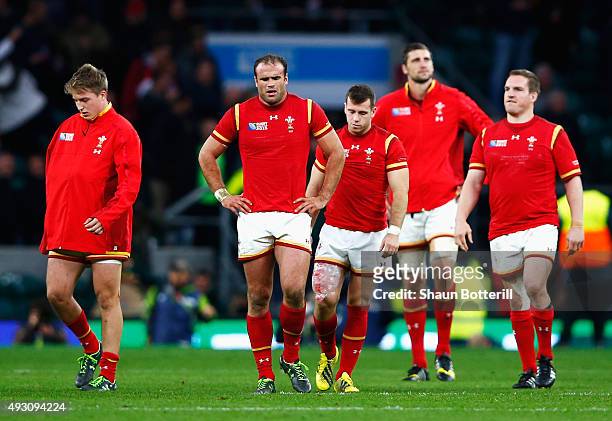 Jamie Roberts of Wales looks dejected with team mates after the 2015 Rugby World Cup Quarter Final match between South Africa and Wales at Twickenham...