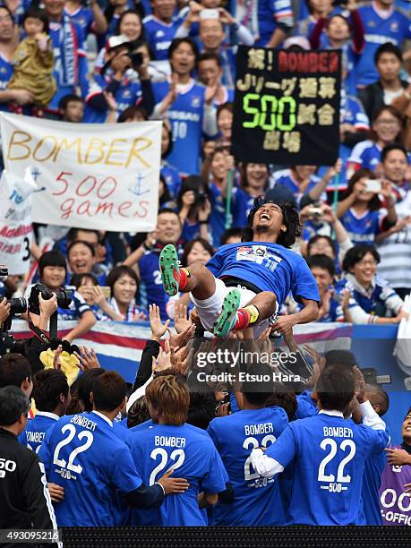 Yuji Nakazawa of Yokohama F.Marinos up in the air after the J.League match between Yokohama F.Marinos and Vissel Kobe at Nissan Stadium on October...