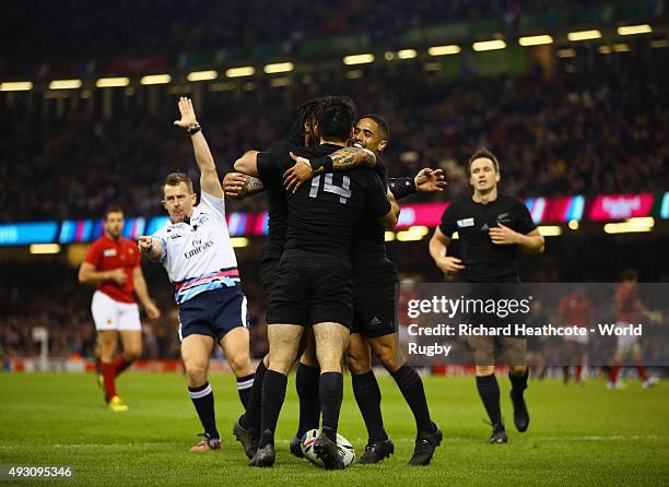 New Zealand players celebrate with try scorer Nehe Milner-Skudder of the New Zealand All Blacks during the 2015 Rugby World Cup Quarter Final match...