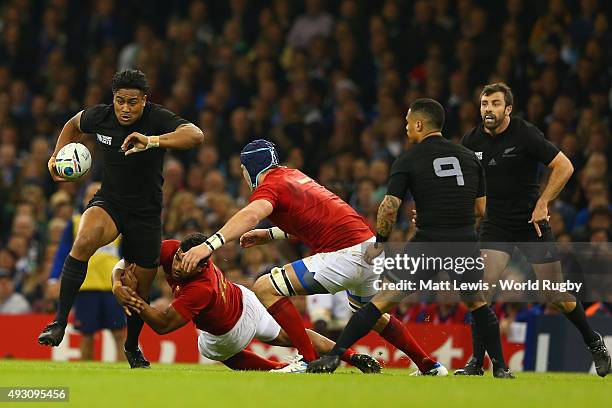 Julian Savea of the New Zealand All Blacks breaks the tackle of Wesley Fofana of France during the 2015 Rugby World Cup Quarter Final match between...