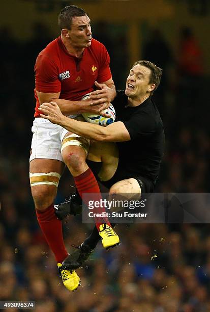 New Zealand full back Ben Smith goes for a high ball with Louis Picamoles during the 2015 Rugby World Cup Quarter Final match between New Zealand and...