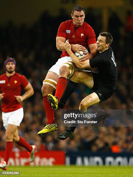 New Zealand full back Ben Smith goes for a high ball with Louis Picamoles during the 2015 Rugby World Cup Quarter Final match between New Zealand and...