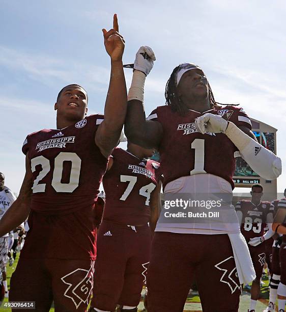 Defensive back Brandon Bryant and wide receiver De'Runnya Wilson of the Mississippi State Bulldogs celebrate after defeating the Louisiana Tech...