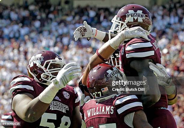 Wide receiver Fred Brown of the Mississippi State Bulldogs celebrates with teammates after catching a pass for a touchdown during the second half of...