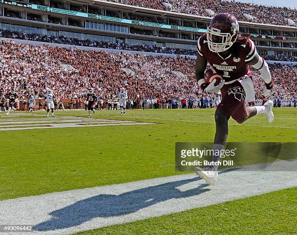 Wide receiver De'Runnya Wilson of the Mississippi State Bulldogs catches a pass for a touchdown during the second half of an NCAA college football...
