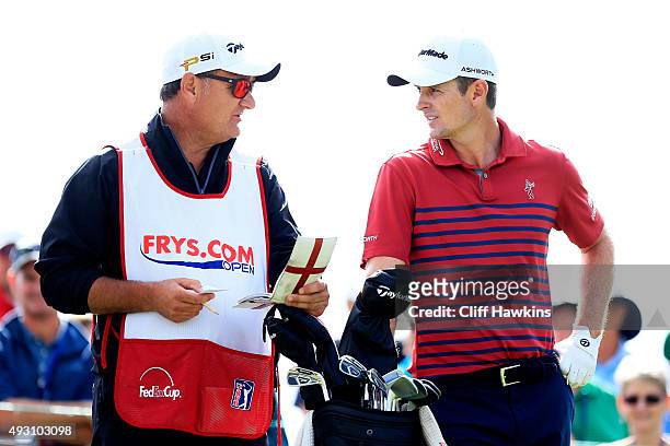 Justin Rose of England talks to his caddie Mark Fulcher on the second tee during the third round of the Frys.com Open on October 17, 2015 at the...