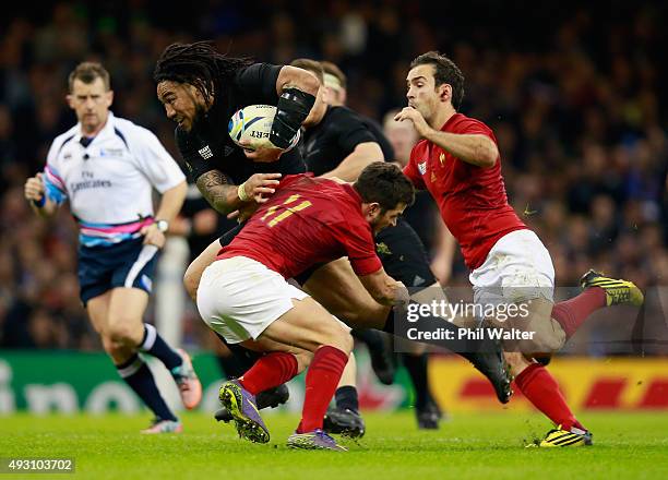 Ma'a Nonu of the New Zealand All Blacks is tackled by Brice Dulin of France and Morgan Parra of France during the 2015 Rugby World Cup Quarter Final...