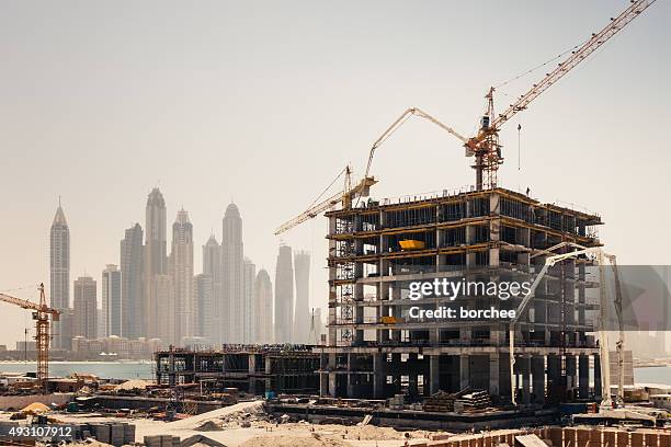 dubai construction - skyscraper construction stock pictures, royalty-free photos & images