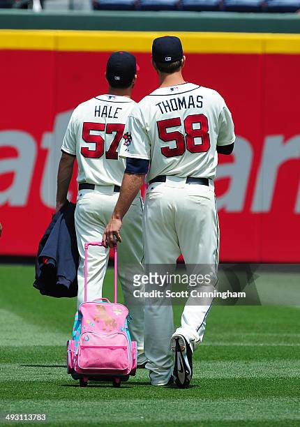 Ian Thomas of the Atlanta Braves heads to the bullpen with David Hale before the game against the Chicago Cubs at Turner Field on May 11, 2014 in...