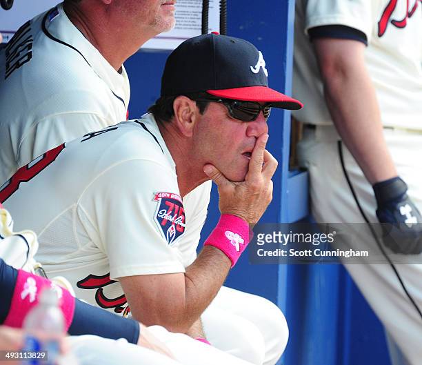 Bench Coach Carlos Tosca of the Atlanta Braves watches the action against the Chicago Cubs at Turner Field on May 11, 2014 in Atlanta, Georgia.