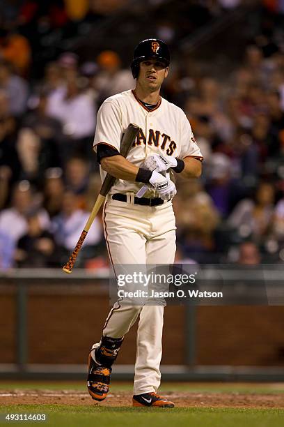 Tyler Colvin of the San Francisco Giants returns to the dugout after striking out against the Atlanta Braves during the fifth inning at AT&T Park on...