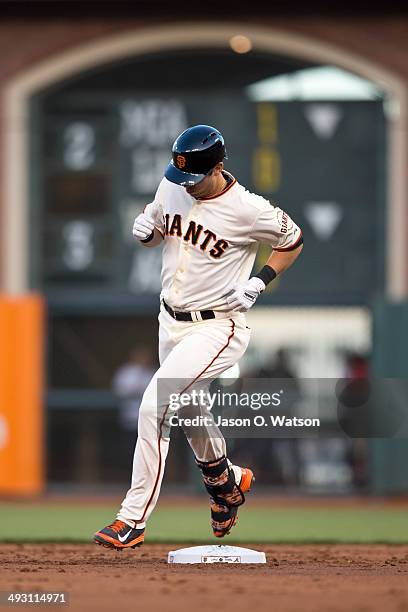 Tyler Colvin of the San Francisco Giants rounds the bases after hitting a home run against the Atlanta Braves during the second inning at AT&T Park...