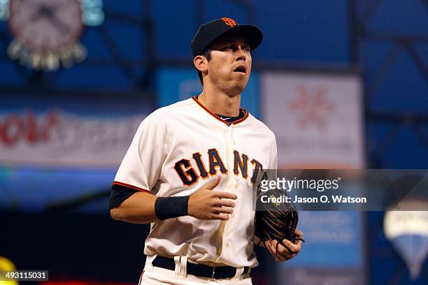 Tyler Colvin of the San Francisco Giants returns to the dugout during the fifth inning against the Atlanta Braves at AT&T Park on May 12, 2014 in San...