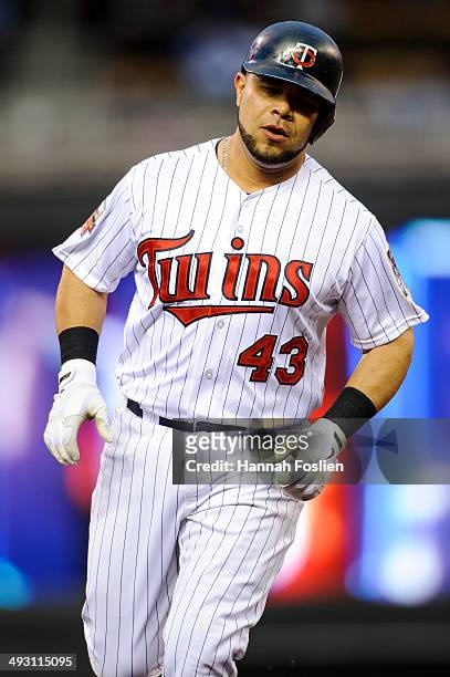Josmil Pinto of the Minnesota Twins rounds the bases after hitting a home run against the Seattle Mariners during the game on May 16, 2014 at Target...