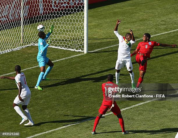 Kaylen Hinds of England heads the ball past Guinea goalkeeper Moussa Camara to score during the FIFA U-17 World Cup Group B match between England and...