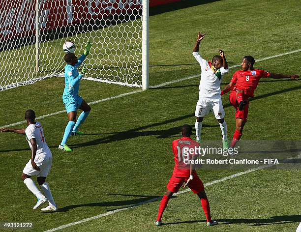 Kaylen Hinds of England heads the ball past Guinea goalkeeper Moussa Camara to score during the FIFA U-17 World Cup Group B match between England and...