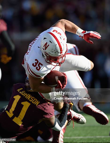 Antonio Johnson of the Minnesota Golden Gophers tackles Andy Janovich of the Nebraska Cornhuskers during the second quarter of the game on October...