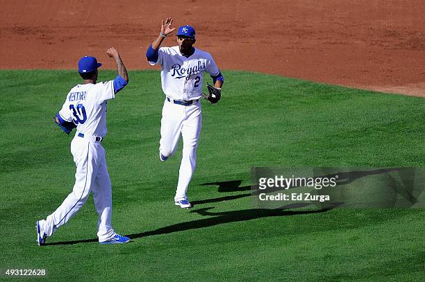 Alcides Escobar of the Kansas City Royals is high fived by Yordano Ventura of the Kansas City Royals after the second inning against the Toronto Blue...