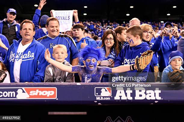 Kansas City Royals fans celebrate after defeating the Toronto Blue Jays in Game 1 of the ALCS at Kauffman Stadium on Wednesday, October 14, 2015 in...