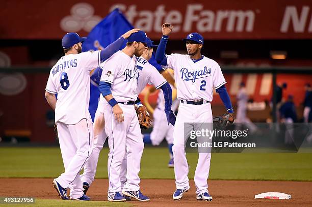 Mike Moustakas, Ben Zobrist, Eric Hosmer and Alcides Escobar of the Kansas City Royals celebrate after defeating the Toronto Blue Jays in Game 1 of...