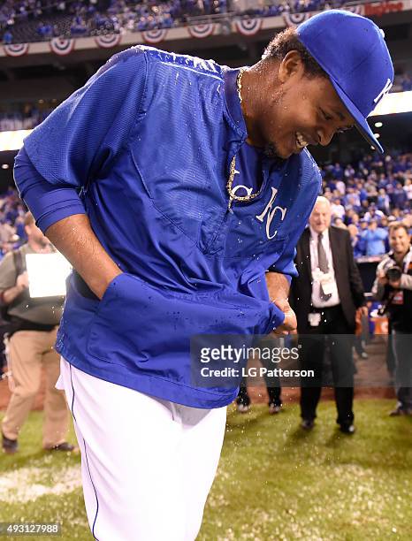 Edinson Volquez of the Kansas City Royals reacts after having the Gatorade water cooler dumped on him following Game 1 of the ALCS against the...