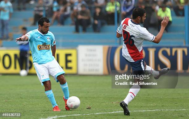 Renzo Sheput of Sporting Cristal kicks to score the second goal of his team against Deportivo Municipal during a match between Sporting Cristal and...