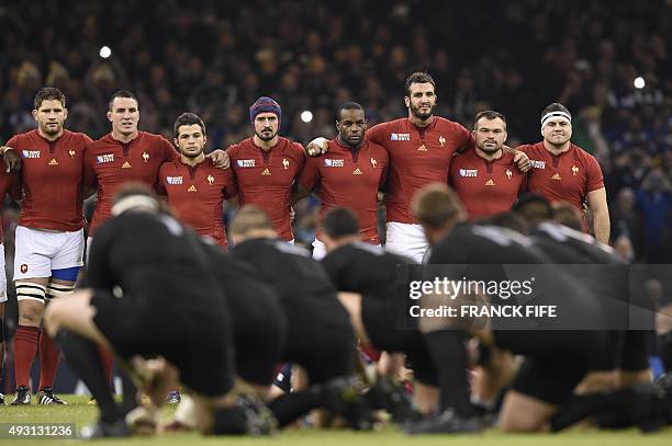 New Zealand's players perform the haka as France's line up prior to a quarter final match of the 2015 Rugby World Cup between New Zealand and France...