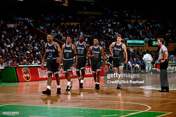 Dennis Scott, Anfernee Hardaway, Shaquille O'Neal, Nick Anderson, and Jeff Turner of the Orlando Magic return to the court during a game played circa...