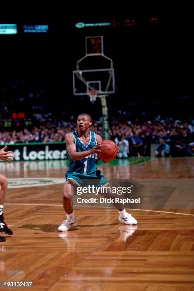 Muggsy Bogues of the Charlotte Hornets looks to pass against the ...