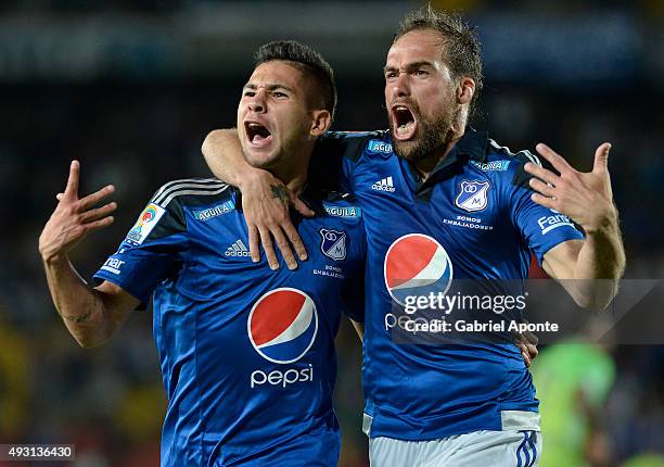 Jonathan Agudelo of Millonarios celebrates with Federico Insua after scoring the second goal of his team during a match between Millonarios and...