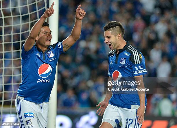 David Silva of Millonarios celebrates with Jonathan Agudelo after scoring the third goal of his team during a match between Millonarios and Jaguares...