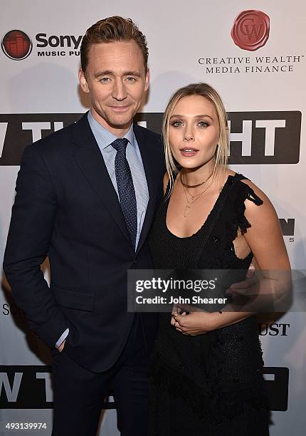 Actor Tom Hiddleston, left, and actress Elizabeth Olsen attend the premiere of "I Saw The Light" at The Belcourt Theatre on October 17, 2015 in...