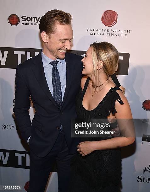 Actor Tom Hiddleston, left, and actress Elizabeth Olsen attend the premiere of "I Saw The Light" at The Belcourt Theatre on October 17, 2015 in...