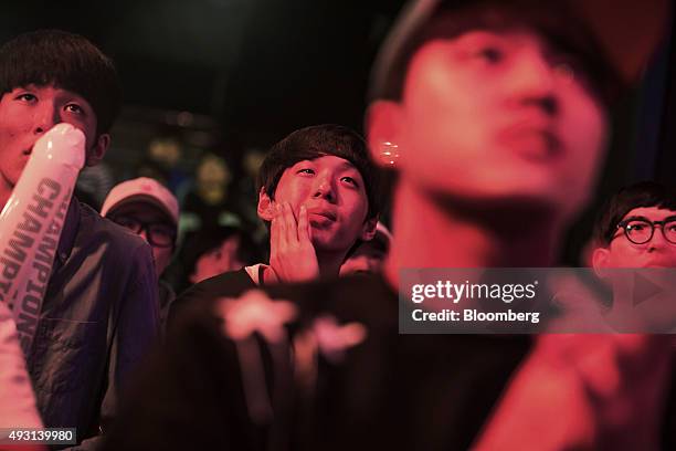 Fans react as they watch the final round of the Electronic Arts Inc. Sports FIFA Online Championship at the Nexon Co. E-Sports Stadium in Seoul,...