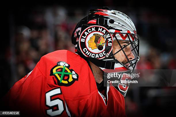 Goalie Corey Crawford of the Chicago Blackhawks looks across the ice in the first period of the NHL game against the Columbus Blue Jackets at the...