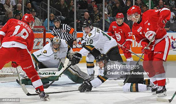 Blake Speers of the Sault Greyhounds fires a shot at Tyler Parsons of the London Knights during an OHL game at Budweiser Gardens on October 17, 2015...