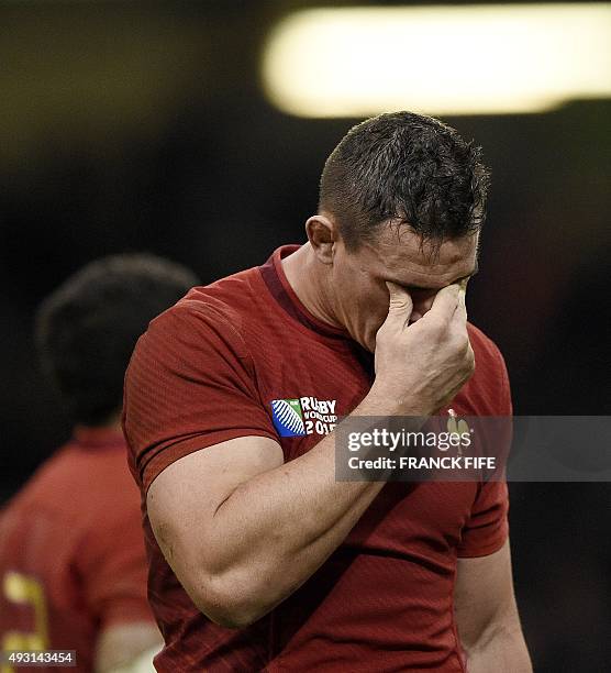 France's number 8 Louis Picamoles reacts after losing a quarter final match of the 2015 Rugby World Cup between New Zealand and France at the...