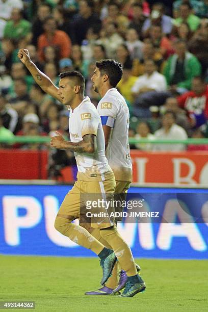 Ismael Sosa of Pumas celebrates with teammate Eduardo Herrera after scoring a goal against Leon during their Mexican Apertura tournament football...